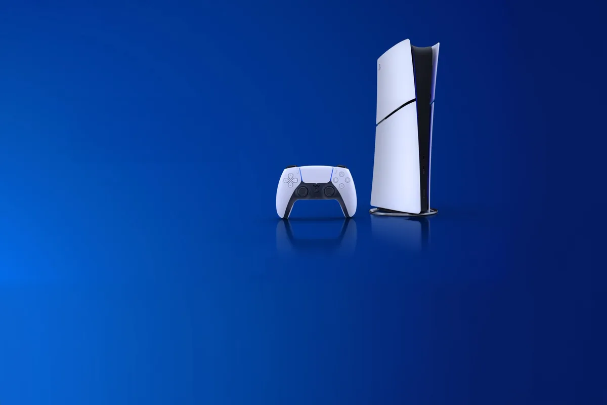 A PlayStation 5 console and controller on a deep blue ground